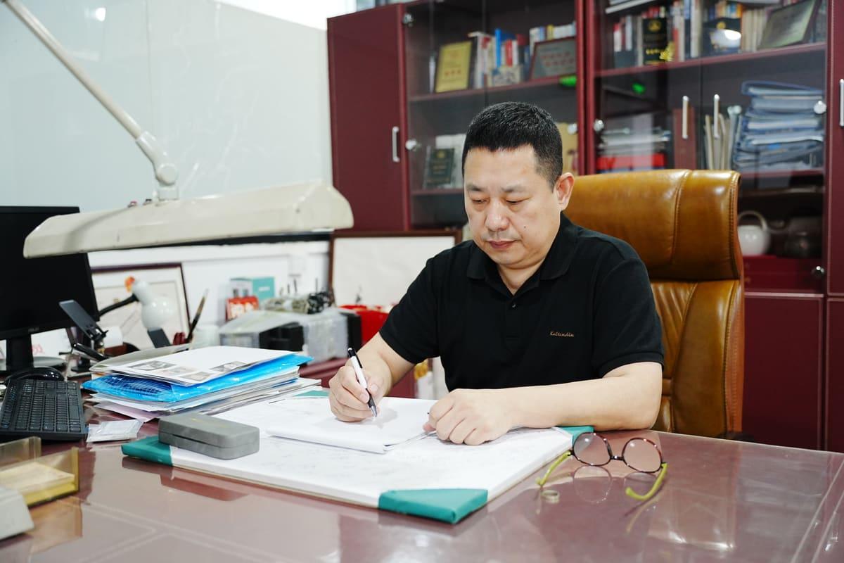 Jewelry designer sketching at the design desk